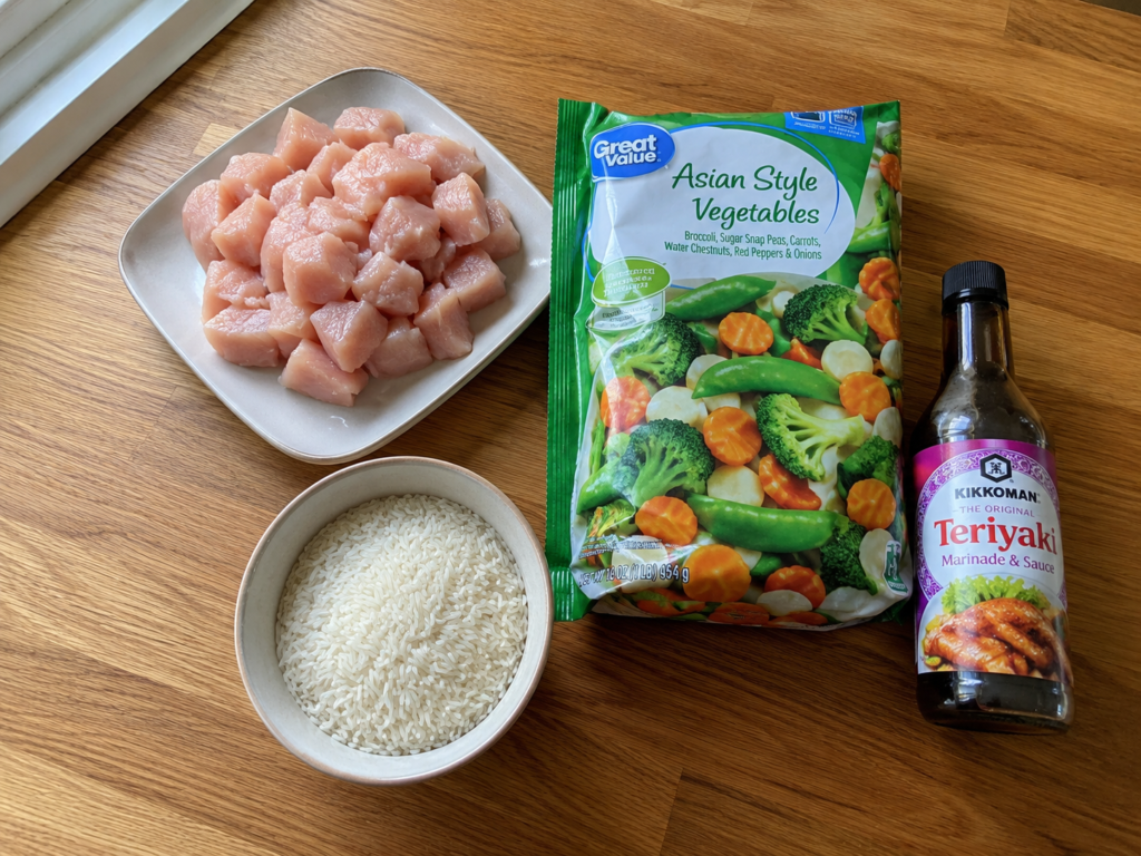 Essential ingredients for easy chicken teriyaki stir-fry including chicken, jasmine rice, and frozen vegetables.
