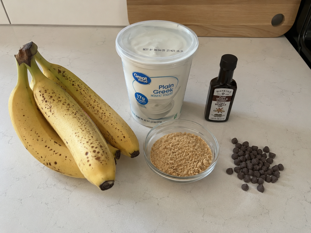 Ingredients for budget-friendly banana pudding breakfast arranged on a counter.